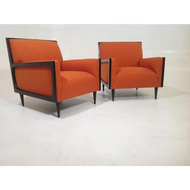 Modern mid century style lounge chairs. The set of chairs are newly upholstered and refinished. The chairs are done in a...
