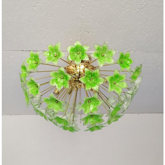 Bring the vibrant charm of mid-century elegance into your space with this stunning flush mount Sputnik chandelier....