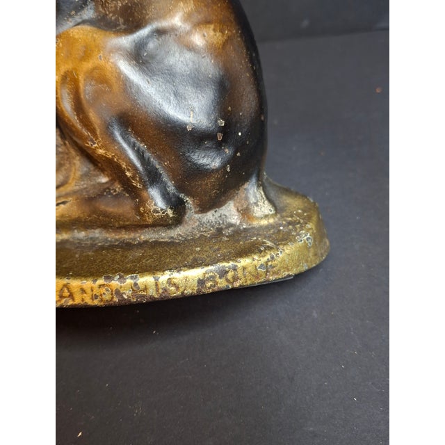 This exceptional, full-figured antique cast iron doorstop depicts a charming, expressive pup titled "Mutt and His Bone."...