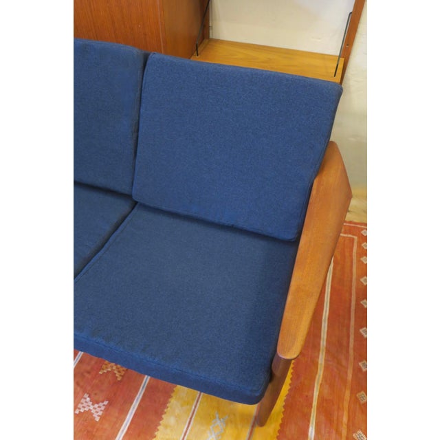 Arne Vodder for France and Sohn 3-seater teak sofa, 1960s. France and Sohn label. The cushions recently re-covered with...