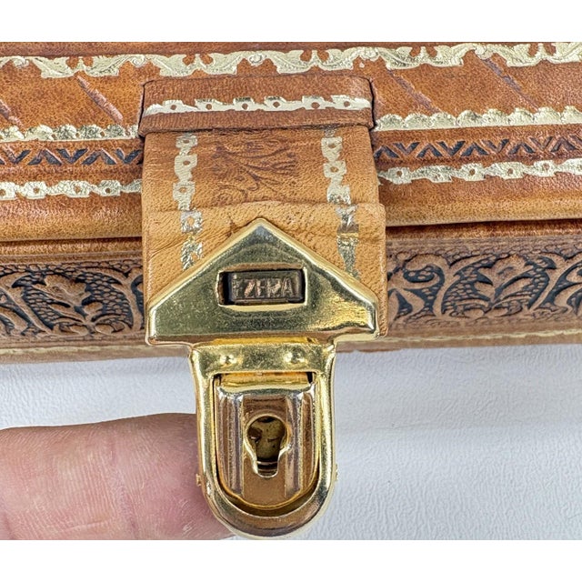 Mid-Century Argentinian Embossed Leather Music Box with Galleon Motif A masterful example of mid-century Argentinian...