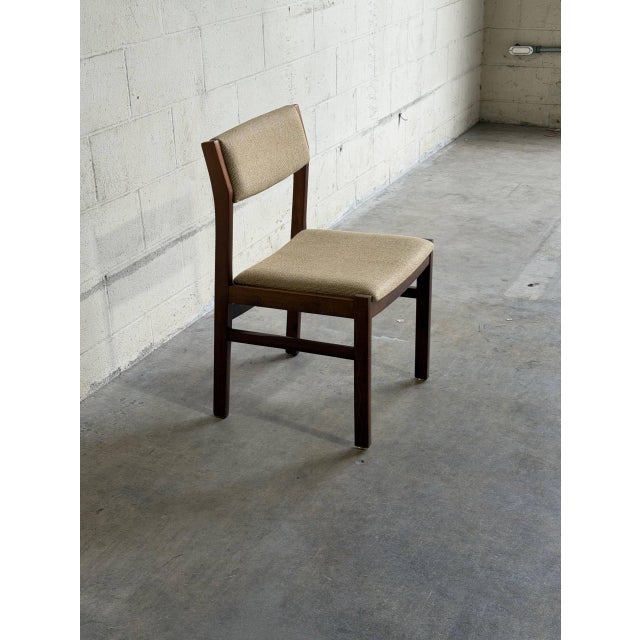 Beautiful vintage Danish modern dining chair crafted in teak and upholstered in a warm neutral textured fabric. The chair...