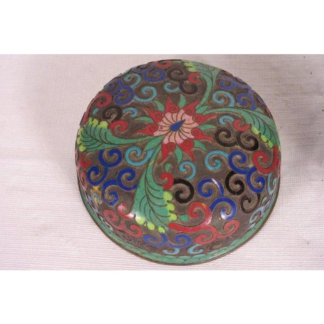 1910 cloisonné jar with lid. One dent in vase area.