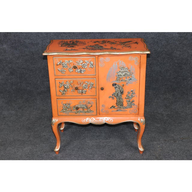 This beautifully decorated Chinoiserie petite cabinet or bedside stand is a charming and highly distinctive accent piece...