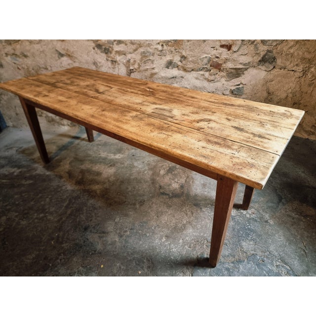 Antique French farmhouse table originating from the Auvergne region, dating from around 1900. This solid and characterful...
