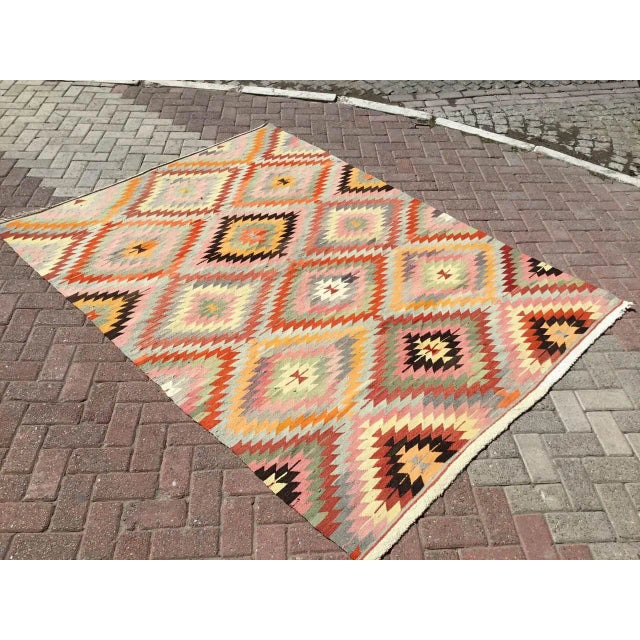 This beautiful, vintage, handwoven kilim is approximately 60 years old. It is handmade, of very fine quality hand spun...