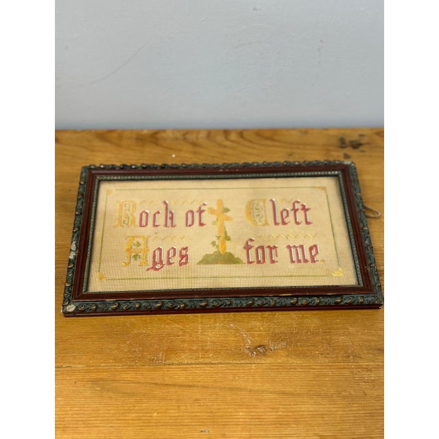 This framed antique English textile art is a beautifully preserved piece of craftsmanship, showcasing intricate embroidery...