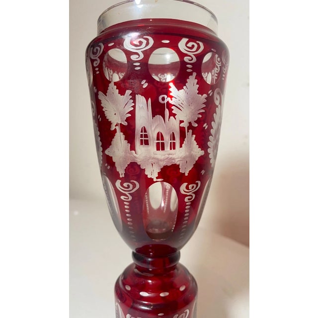 This lovely Moser example features a vibrant ruby red color done in cut to clear style and etched with intricate design...