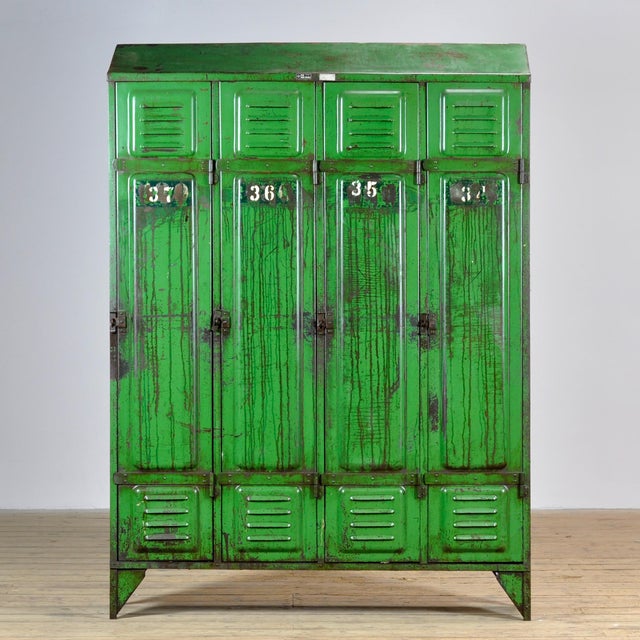 This locker was made in France around 1950 and features four compartments to store all your belongings. The upper section...
