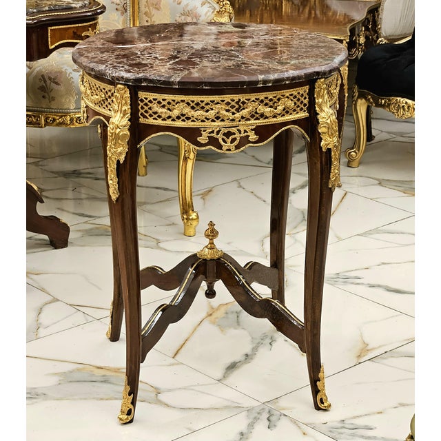 Elevate your interior with this exquisite French-inspired side table, featuring a beautifully veined brown marble top and...