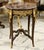Elevate your interior with this exquisite French-inspired side table, featuring a beautifully veined brown marble top and...
