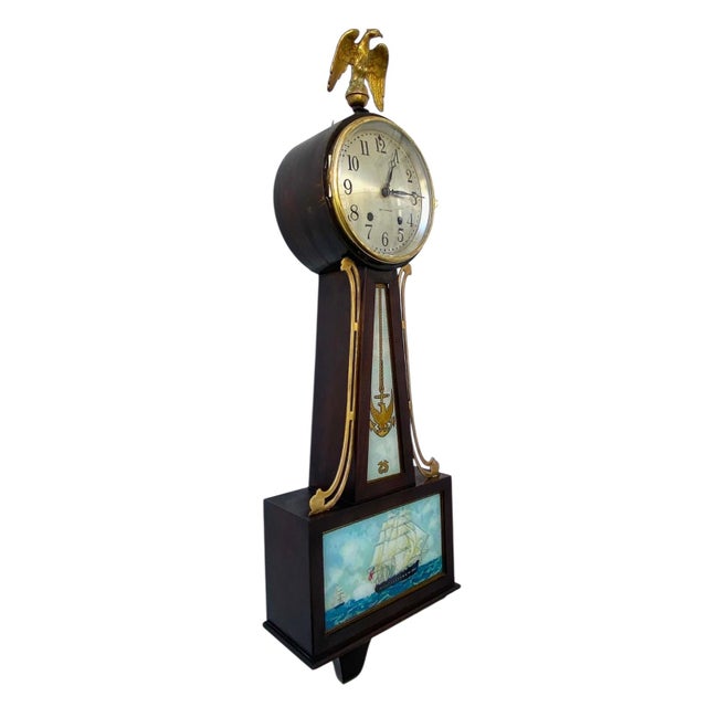 Vintage Mid-Century Nautical Theme, Seth Thomas banjo clock. This clock features reverse-painted glass panels with USS...