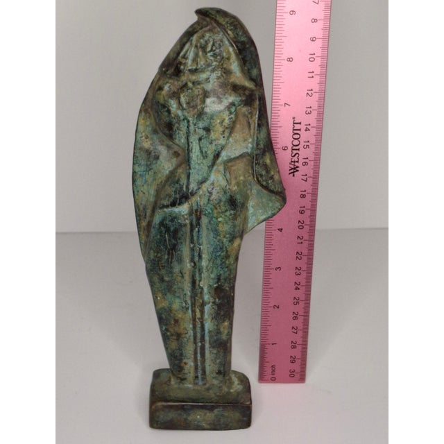 This striking 9-inch sculpture embodies the minimalist spirit of the Mid-Century Modern era. The figure is cast in solid...