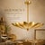 Handcrafted Antique Brass Flower Chandelier – 4-Light Sculptural Ceiling Pendant Bring sculptural elegance and warm...