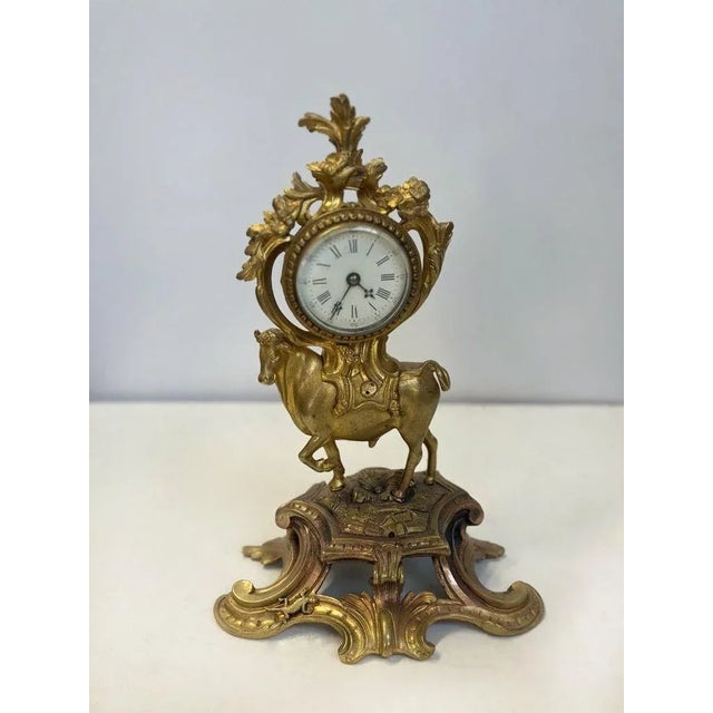 This 19th century French bronze clock showcases the beautiful Rococo style, featuring a regal bull figure atop a floral...