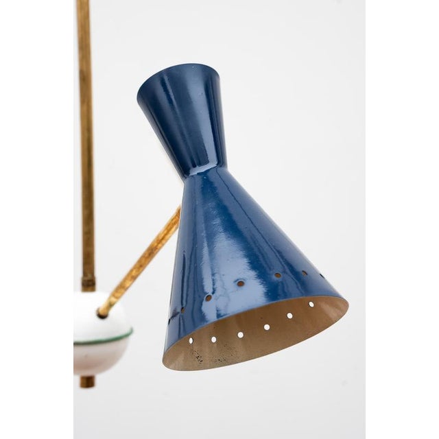 Three-light chandelier from the 1950s, STILNOVO style, Made in Italy. This Stilnovo-style brass and aluminum chandelier...