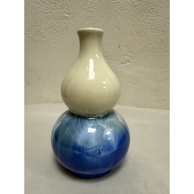 Double gourd shaped vase with pretty crystalline glaze in blue and cream. The vase is marked on the bottom.