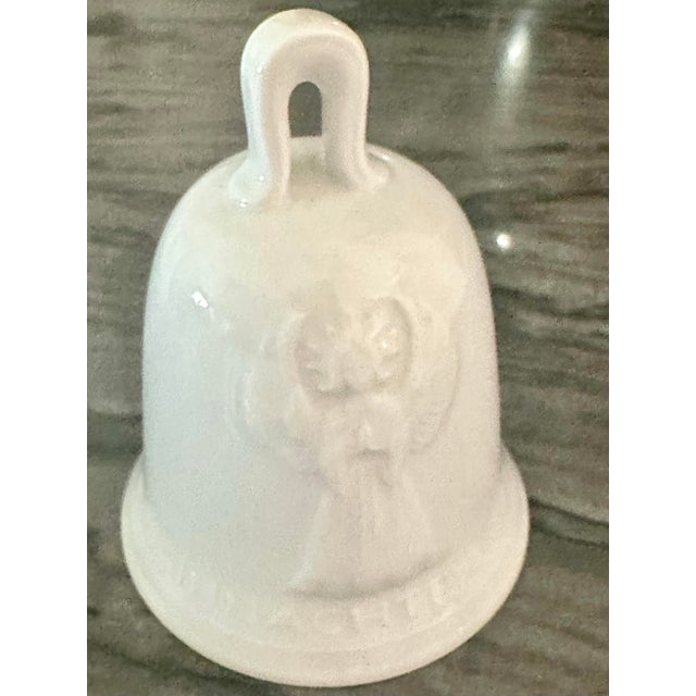 Beautiful white porcelain angel bell. Made in a Germany in the 1970s. Shooting star in the opposite side of the angel.