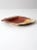 This vintage studio pottery plate features a hand-crafted shallow bowl form with a softly speckled glaze in earthy brown,...
