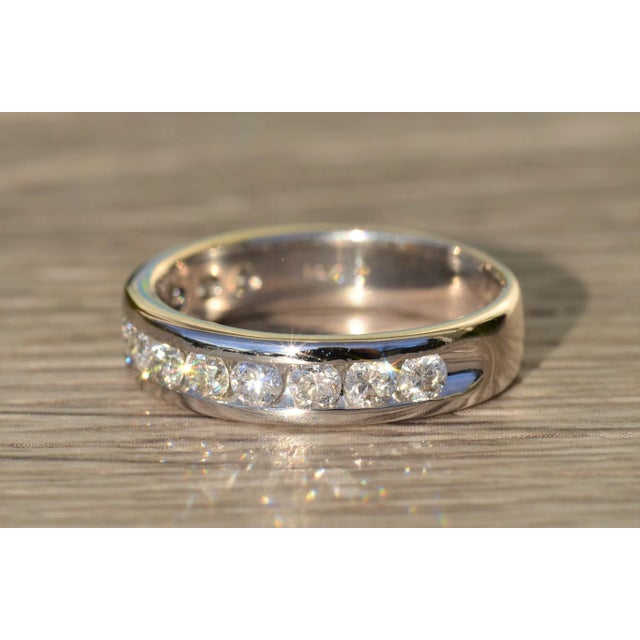 The Myles Gentleman's 14K Channel Set Diamond Wedding Band. This men's band features 1.20 carats of diamonds in total...