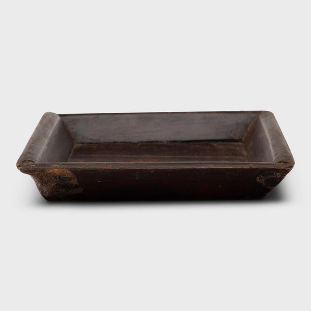 Simple lines, a modest form and a layer of hand-brushed lacquer give this petite Qing-dynasty tray a provincial charm that...