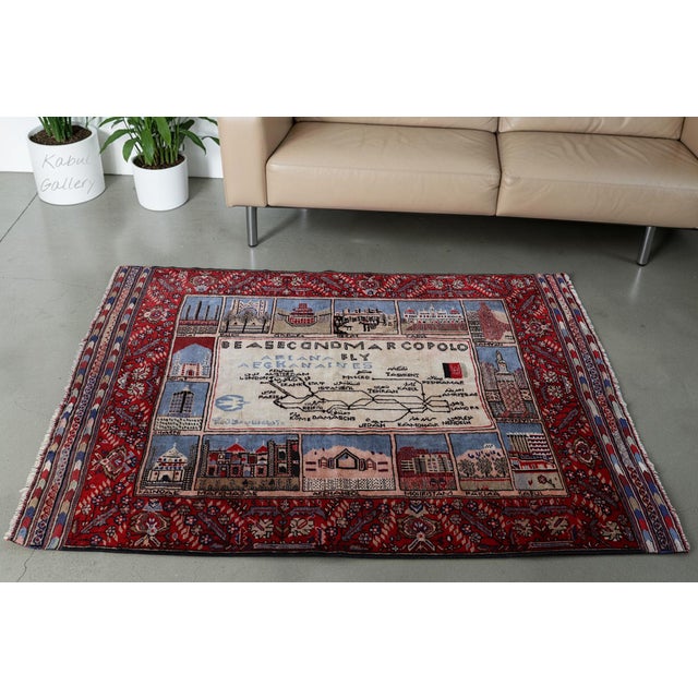 6,4 x 4,7 feet very rare hand-knotted rug with ariana afghan airlines flight routes. rugs woven by the baloch nomadic...