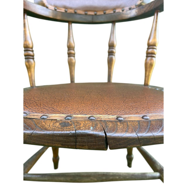 A beautifully and naturally distressed English Elm Smoker’s Bow Arm or Captains chair dating from the mid-late 19th...