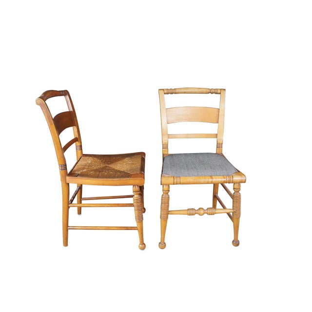 Six vintage Rike-Kumler Early American style dining chairs. Made of maple featuring rush seats and turned accents. Two of...