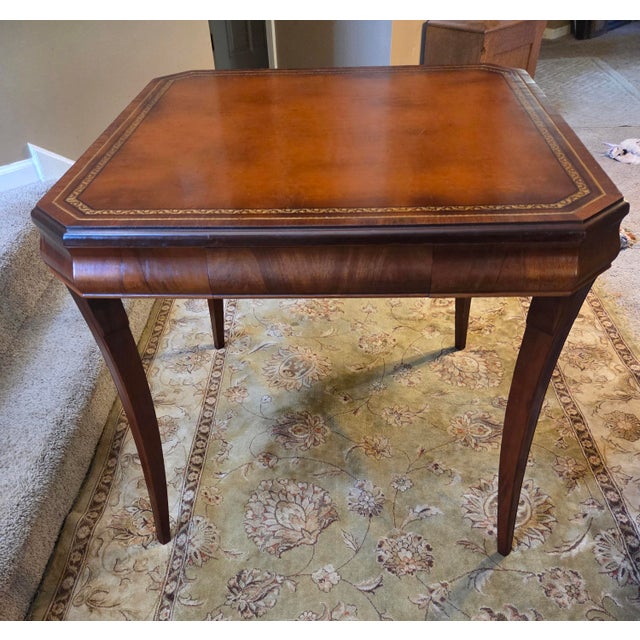 Exceptional vintage game table, featuring a striking gold-tooled leather playing surface. Combining classic sophistication...
