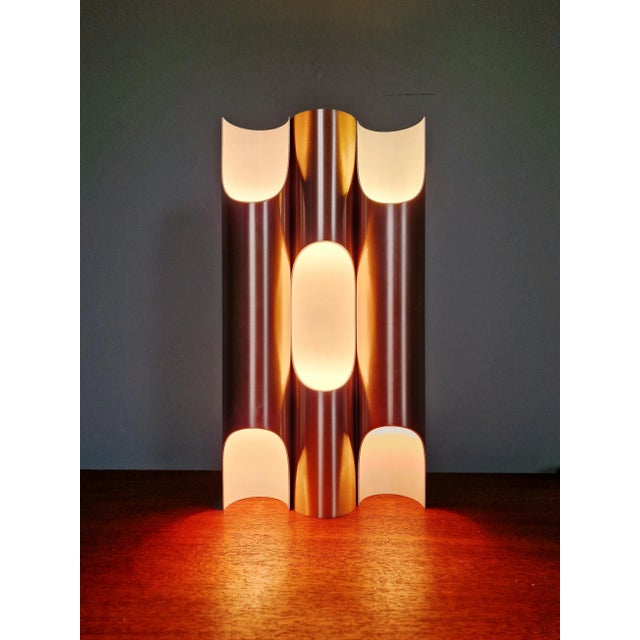 Set of three anodized aluminum wall sconces, designed by maija liisa komulainen, fuga model, for the dutch manufacturer...