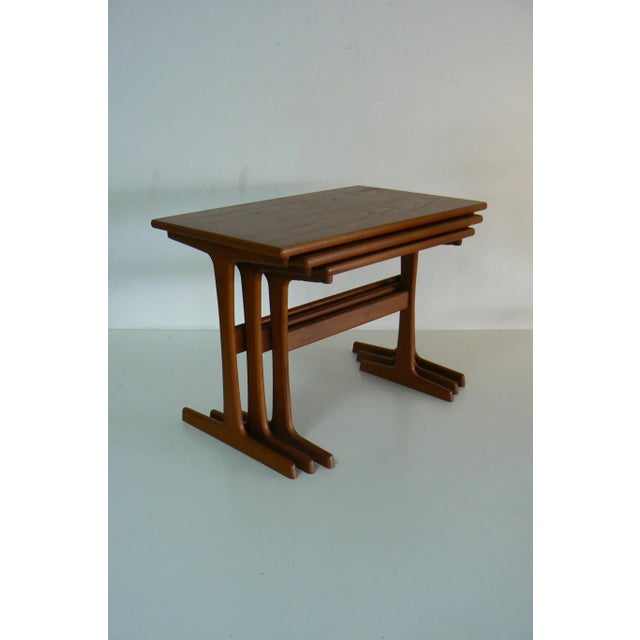 This set of three teak nesting tables was designed by Kai Kristiansen for Vildbjerg Møbelfabrik in the 1970s. Labeled with...