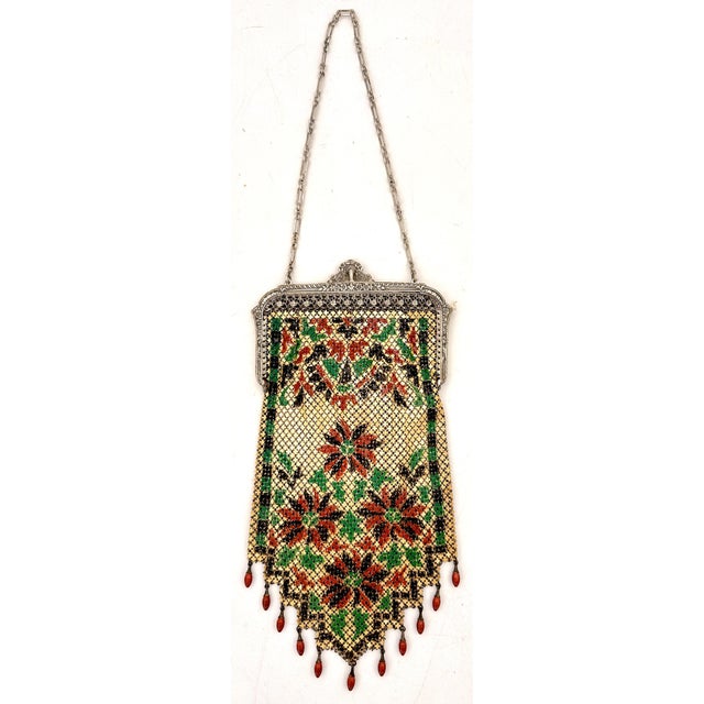 Mandalian Art Deco Enamel Mesh Purse with Floral Motif and Drop Beads, USA, Circa 1920s Description: A vibrant example of...