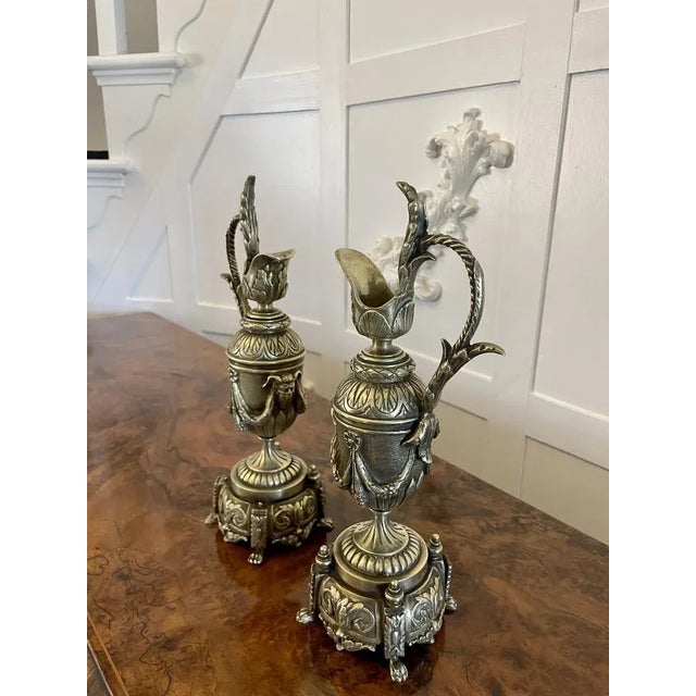 Pair of antique Victorian quality ornate brass Ewers Having quality brass foliate decoration unusual shaped handles ornate...