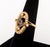 14K Yellow Gold Diamond Sapphire Ring, featuring twenty six pave set round brilliant cut diamonds weighing a total of...