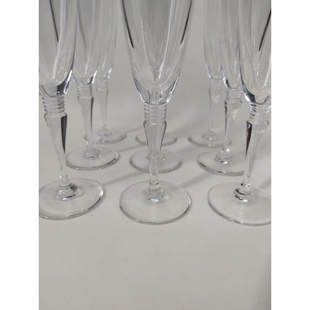 Nine Saint Louis crystal flutes, Grand Lieu pattern. 20th century. Very elegant and stamped on the base, they are in very...