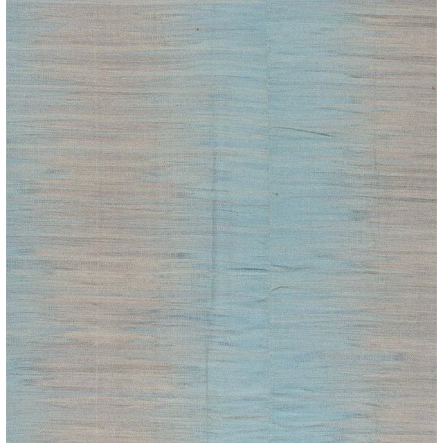 Beautiful hand-knotted modern Kilim rug with a turquoises field, and tan accents an allover abstract design. This rug...