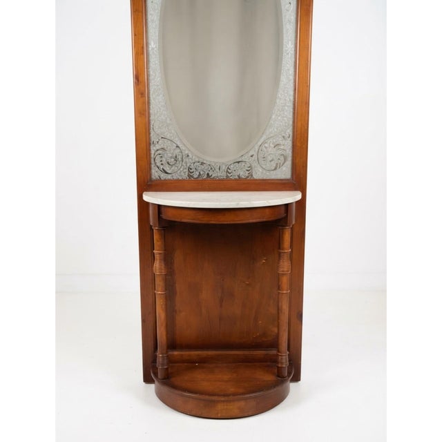 A handsome vintage hall tree inspired by Victorian and Eastlake designs, featuring a warm wood finish, decorative etched...