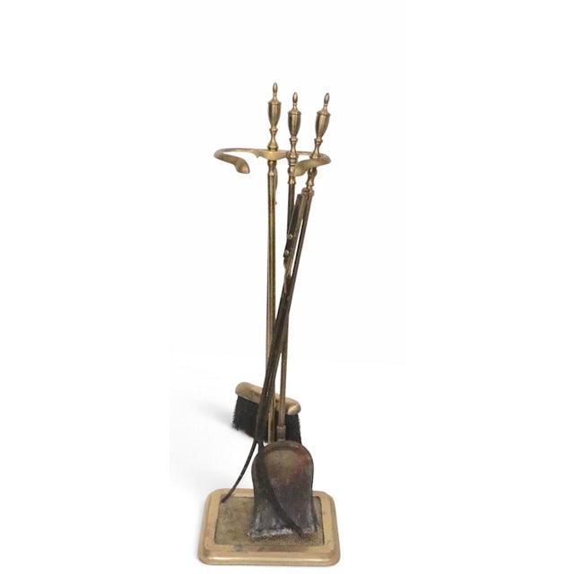 Vintage brass fireplace tool set including a tongs, shovel, brush and stand. The set is in good original, clean and ready...
