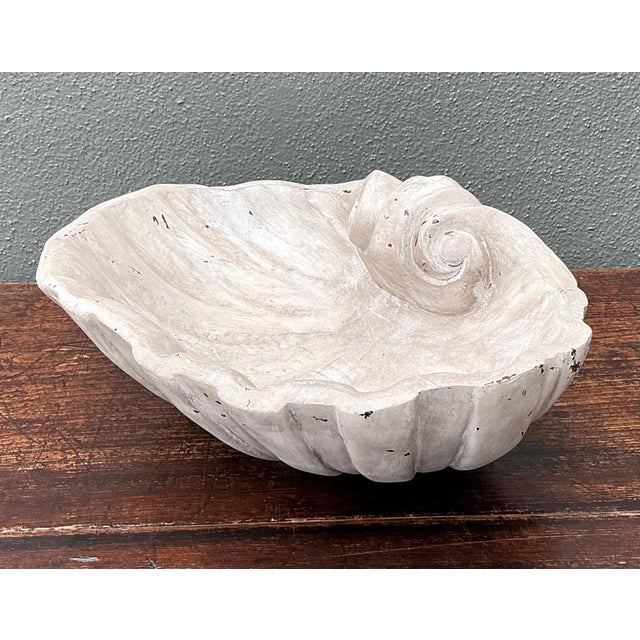 This vintage Italian carved wood shell bowl beautifully embodies the organic elegance and exceptional craftsmanship...