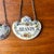 Set of two hanging decanter Labels. The one made with enamel on metal is definitely much older than the ceramic one. These...