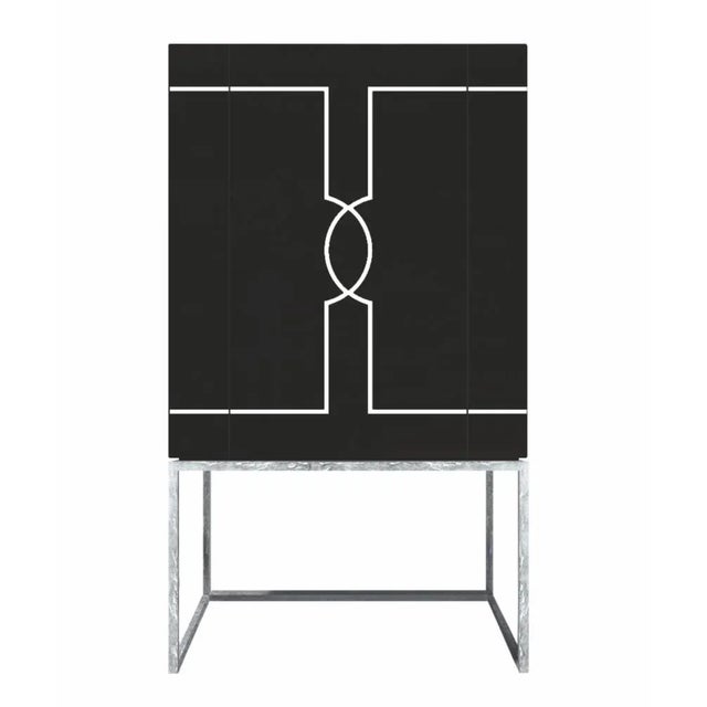 This one-door drink cabinet beautifully crafted by the finest Italian arti-sans, rests on a silver leaf metal frame and...