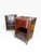 A handsome pair of Bombay Company nightstands, dating to 2002, featuring an elegant Neoclassical and Empire Revival-...