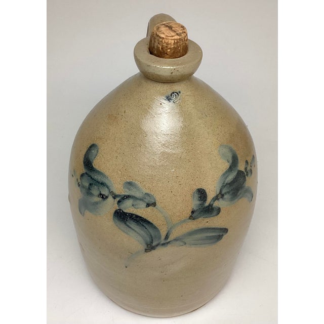 Antique American Blue Flower Decorated 2 Gallon Jug. 13 1/2 inches tall without the cork 8 inches in diameter. Wonderfull...