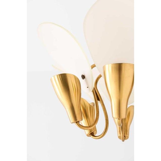 This rare ceiling lamp, designed by Carl Fagerlund and produced by Orrefors in Sweden, stands as an exemplary fusion of...