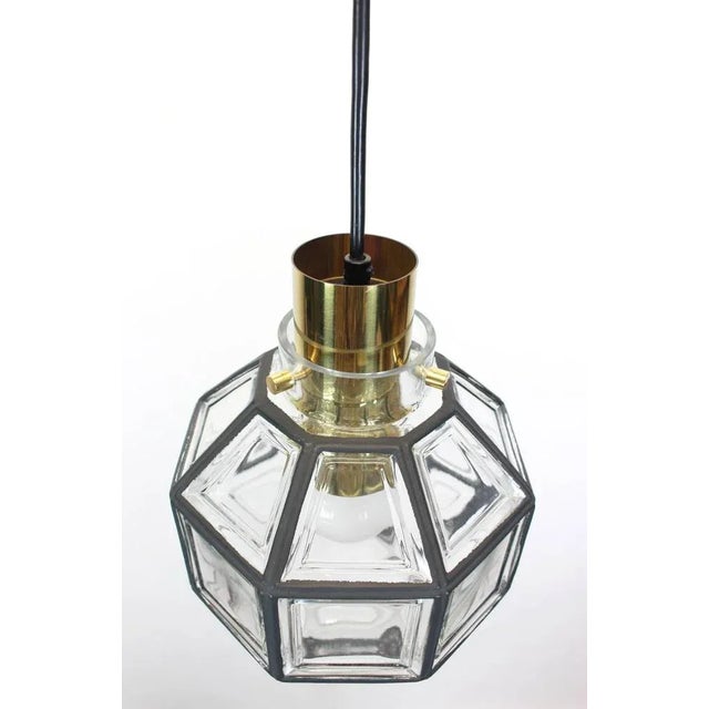 Minimalist iron and clear glass pendant light manufactured by Limburg Glashütte, Germany, circa 1960-1969. Octagonal...