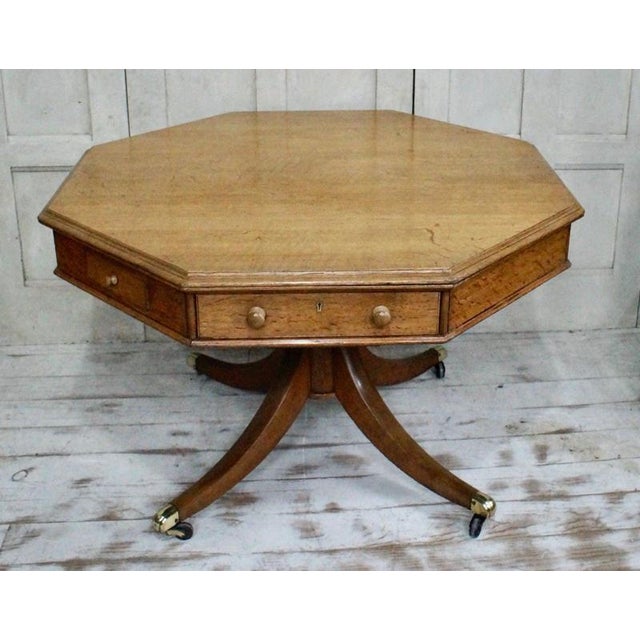 A superb English Regency octagonal drum table dating to circa 1810, finely constructed from oak and distinguished by its...