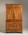 Carved oak two-part cabinet in Warm Honey Oak. The warm honey oak surface highlights burl-veneered door panels, molded...