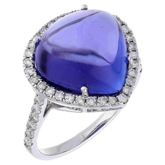 This extraordinary large Cabochon of 10.10 carat tanzanite is a true gemstone that is highly treasured. It is surrounded...