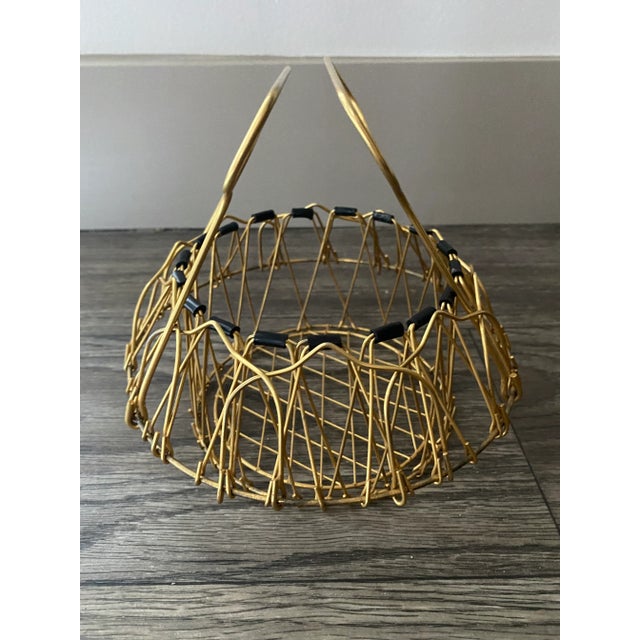 Vintage French wire basket by Escaut The “magic basket" received numerous prizes at different fairs throughout the 1950s....