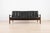 Exceptional Scandinavian three-seat sofa from the 1960s, crafted from solid wood and upholstered in original black...